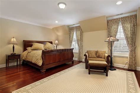 Master Bedroom With Cherry Wood Flooring Stock Photo - Image of carpet, dwelling: 29174502