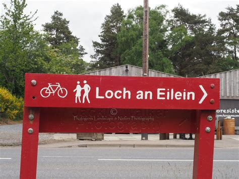 a red sign sitting on the side of a road