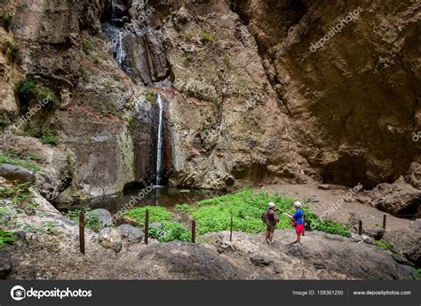 Barranco del Infierno waterfall and tourists — Stock Photo © Steffus #158361250