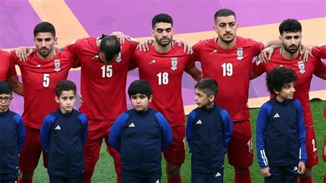 Iran's soccer team silent during national anthem in Qatar in support of ...