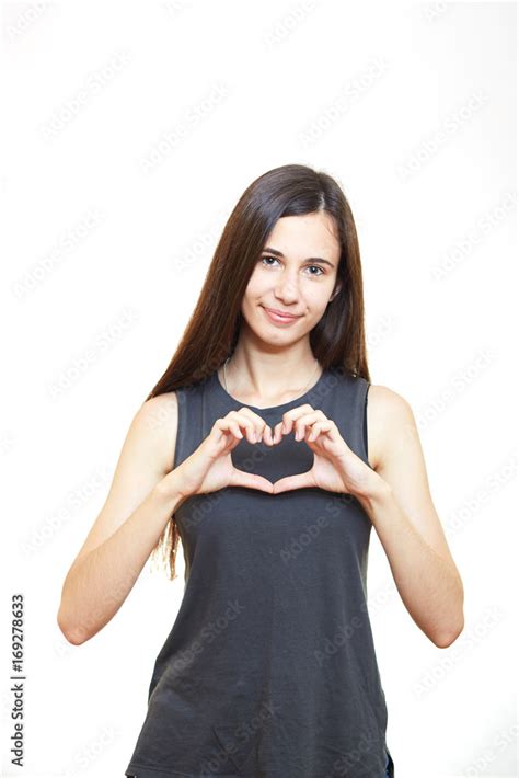 woman present heart hand sign with close up happy face pose by ...