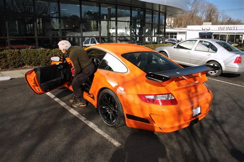 File:Ralph Lauren getting in his orange 997 GT3 RS.jpg - Wikimedia Commons