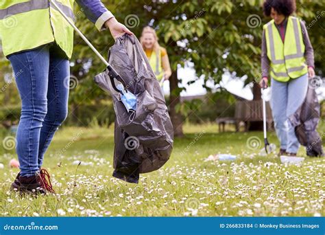 Close Up of Female Volunteers Picking Up Litter in the Countryside ...