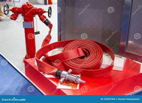 Fire Hydrant with Fire Hose Stock Photo - Image of safety, open: 132207566