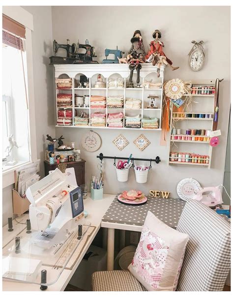 a sewing room with lots of crafting supplies on the wall and shelves above it