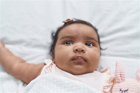 African American Baby Lying on Bed Covering with Blanket at Bedroom ...