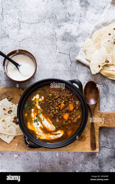 Spicy lentils soup with yoghurt Stock Photo - Alamy