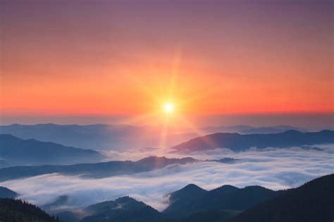 Premium Photo | Misty sunrise in summer in mountains