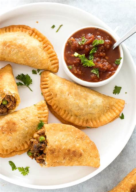 Empanadas are loaded with ground beef, potatoes, peas and tons of Mexican spices. Just in time ...