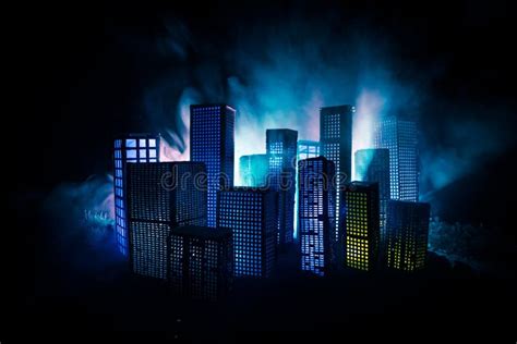 Creative Artwork Table Decoration with Little City Buildings Glowing at Night. Modern City ...