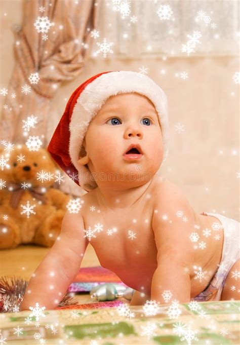 Toddlers in Christmas hats stock image. Image of gift - 6590583