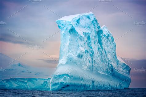 Antarctic iceberg floating in ocean ~ Nature Photos ~ Creative Market