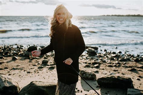 Woman Laughing On The Beach In Wintertime Photograph by Cavan Images - Fine Art America