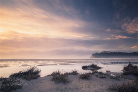 Sunrise on the flooded beach at Poetto seafront, Sardinia