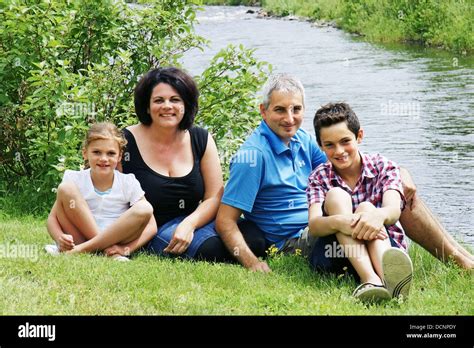 Family by the river Stock Photo - Alamy