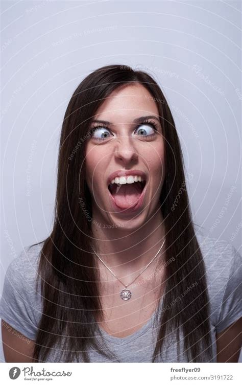 Portrait of a crossed eye woman making silly faces - a Royalty Free ...