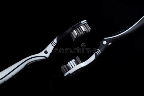 Black White Toothbrush Isolated on a Black Background Stock Image - Image of isolated, object ...