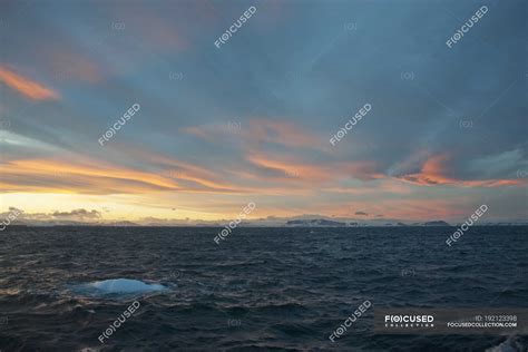 Sunset in Weddell Sea with iceberg in water. — weather, ocean - Stock ...