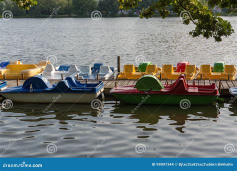 Pedal Boats at a Wooden Pier on a Lake Stock Photo - Image of outdoors, colour: 99097344