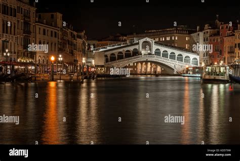 a long exposure of the Ponte di Rialto by night Stock Photo - Alamy