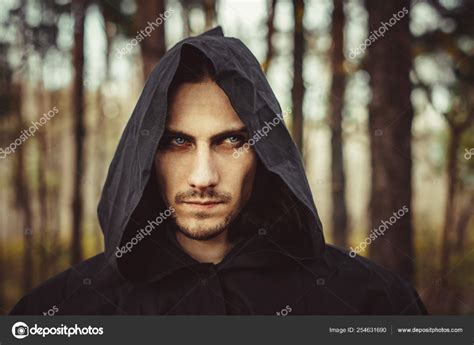 Download - A creepy man in a black hood in the forest — Stock Image Creepy Man, Forest Photos ...