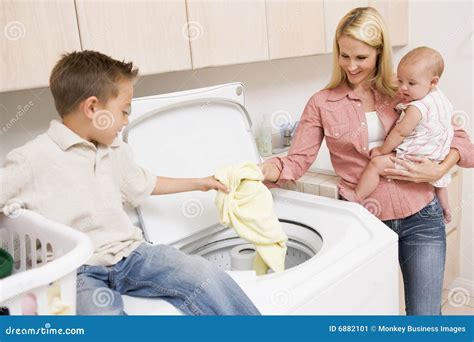 Mother And Children Doing Laundry Stock Image - Image: 6882101