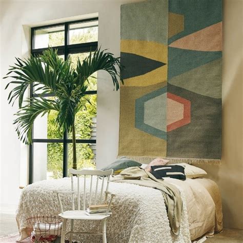 Using Rugs as Wall Art: Hanging Interior Design Trend