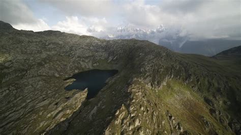 Aerial Flying Along Steep Cliffy Reinebringen Mountain Ridge With Hiking Trail Revealing Fjords ...