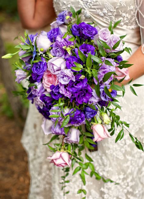 Cascading bridal bouquet with purple and lavender Lisianthus.