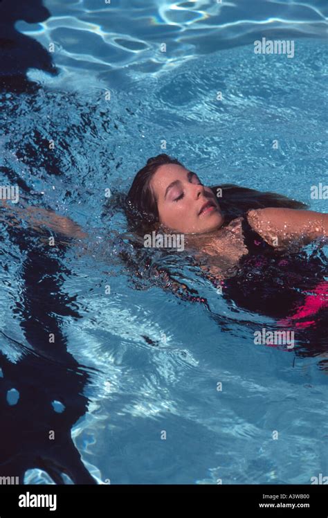 woman swimming in pool recreational or lap swim sidestroke side stroke ...