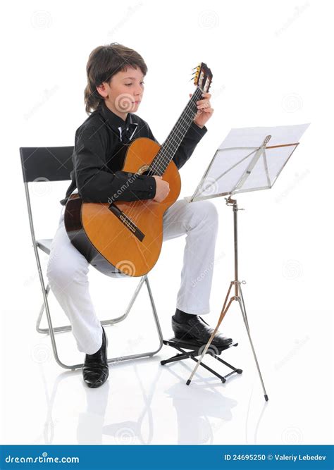 Little Boy Musician Playing Guitar Stock Photo - Image: 24695250