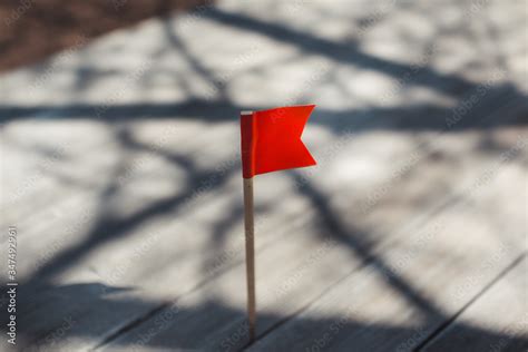 red flag on the beach Stock Photo | Adobe Stock