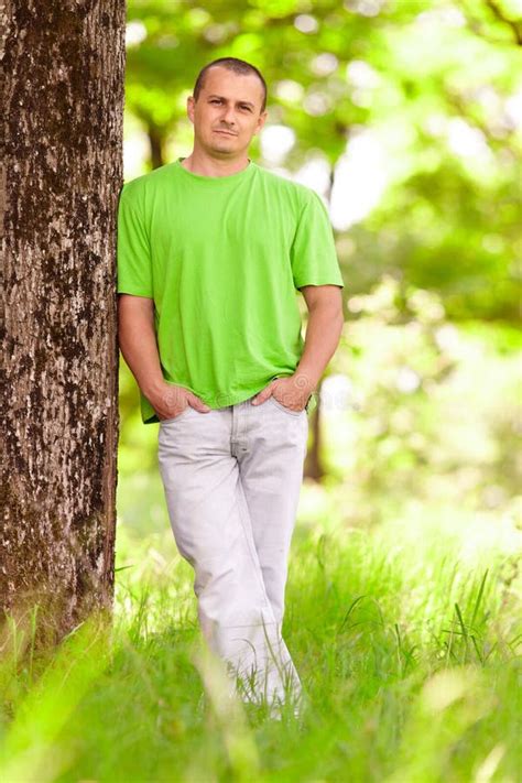 Young man in the forest stock photo. Image of lifestyle - 19632422