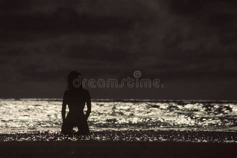 Silhouette of swimmer in water. A black and white view of the ...