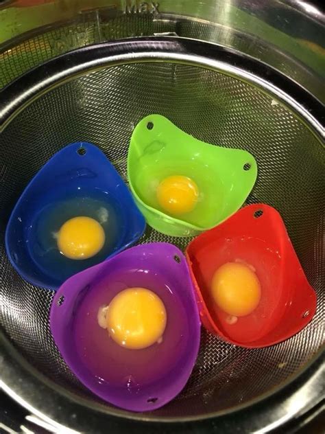 three eggs are sitting in the middle of a strainer