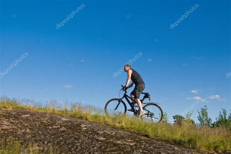 Young man on a mountain bike — Stock Photo © misima #11419568