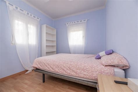 Premium Photo | A double bedroom with pale blue walls and translucent