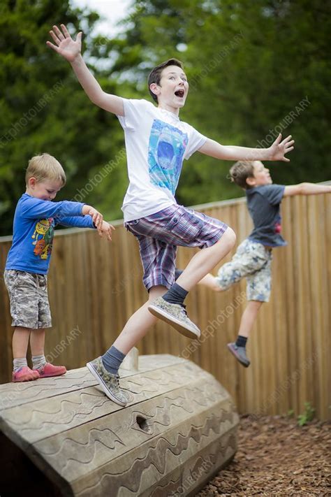 Boys playing in park - Stock Image - F012/8157 - Science Photo Library