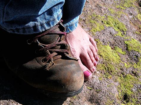 hiking boot and bare foot | note the pink toenail polish | Flickr