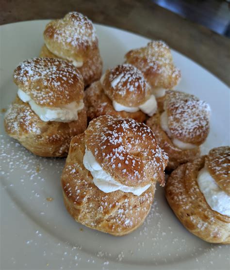 First time trying choux pastry. Cream puffs with lemon curd and whipped ...