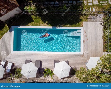 Two Person Swim in the Pool at the Hotel. View from Above, Couple Men ...