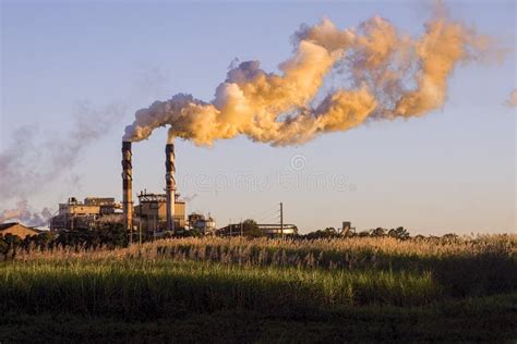 Sugar Cane Mill Factory with Smoke from Stacks at Sunset Stock Photo ...