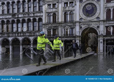 VENICE, ITALY - November 24, 2019: St. Marks Square Piazza San Marco during Flood Acqua Alta in ...