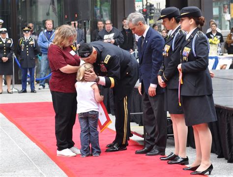 DVIDS - Images - Gen. Odierno kisses forehead of Gold Star family member [Image 10 of 13]