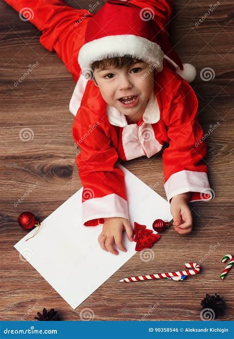 Child in a Suit of Santa Claus Writing a Letter Stock Photo - Image of ...