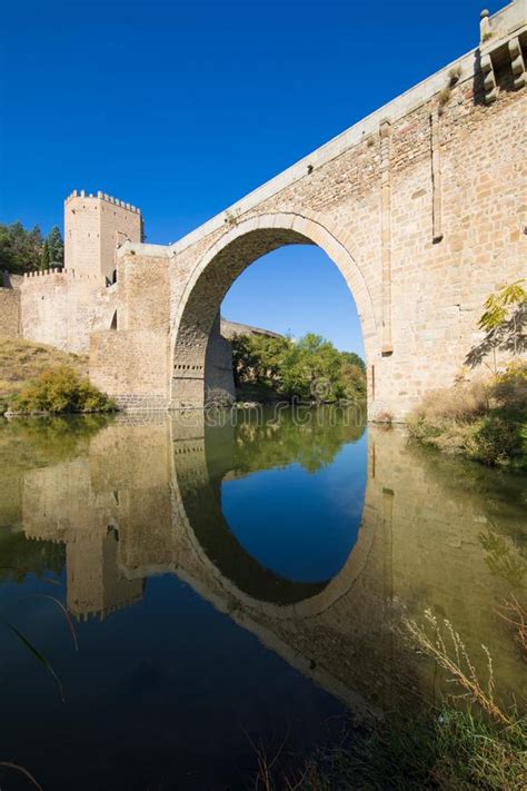 Arch of Alcantara Bridge Reflected in River Tagus Stock Image - Image of historic, history ...