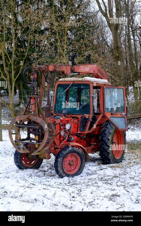 vintage belarus mtz 80 tractor with crane arm manufactured by minsk tractor works being used to ...