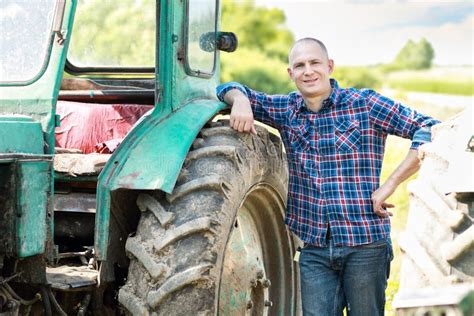 Farmer Driving Tractor in Countryside Stock Photo - Image of harvest ...