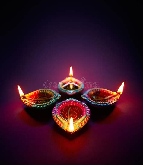 Diwali oil lamp. Colorful clay diya lamps lit during diwali celebration ...