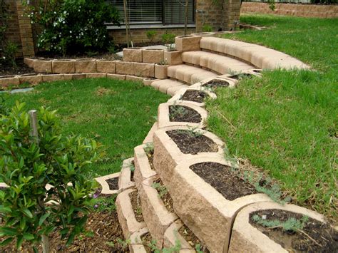 Curved stairs with retaining blocks - Terraforce | Landscaping a slope ...